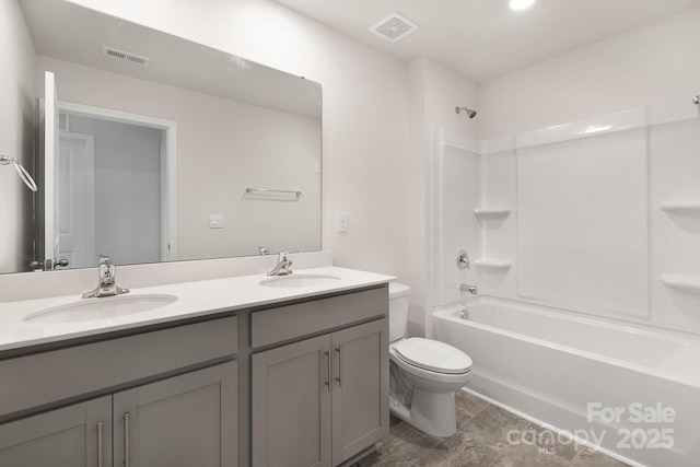 full bathroom with toilet, vanity, and tub / shower combination