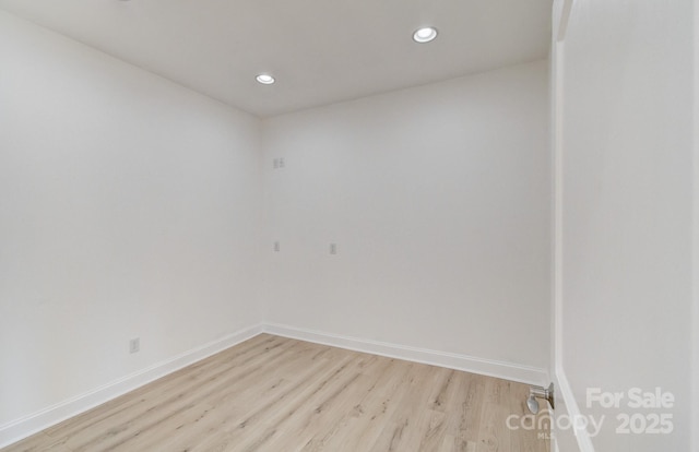 unfurnished room featuring recessed lighting, baseboards, and light wood finished floors