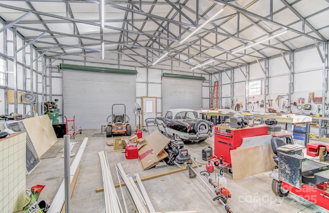 garage with metal wall and a workshop area