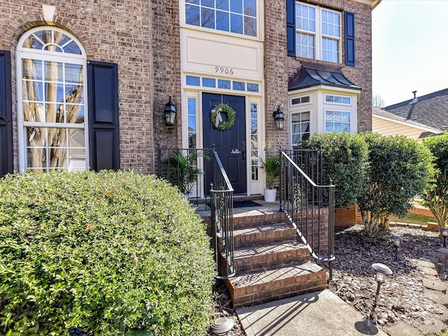 entrance to property with brick siding