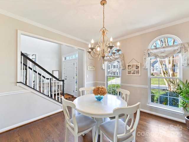 dining space featuring an inviting chandelier, crown molding, stairway, and dark wood-style flooring