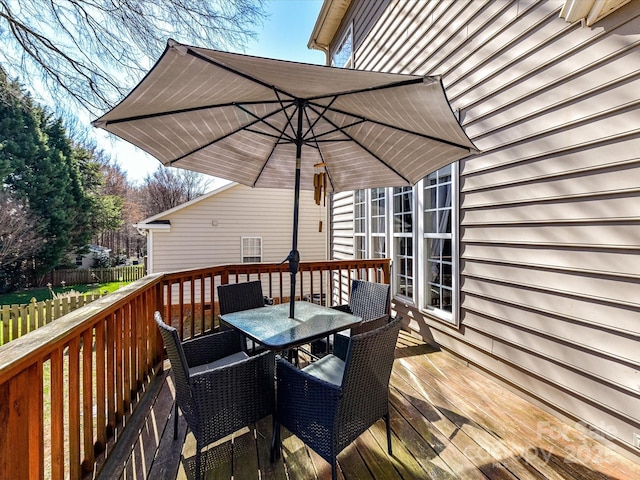 wooden deck with outdoor dining area