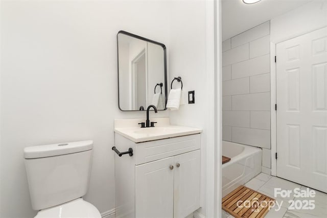 bathroom with toilet, shower / bathing tub combination, and vanity