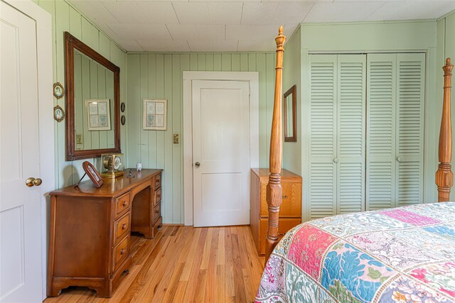 bedroom featuring a closet and light wood-type flooring