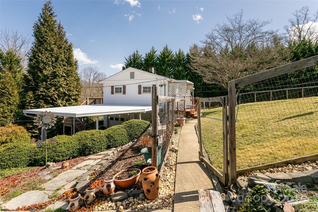 view of yard featuring fence and a gate