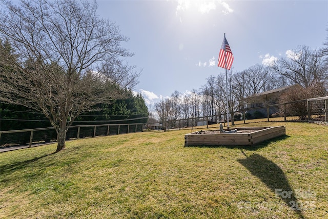 view of yard featuring a garden and fence