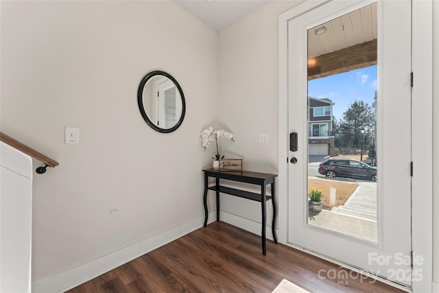 entryway featuring dark wood-style flooring and baseboards