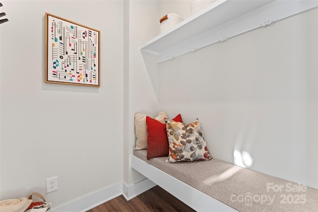 mudroom featuring baseboards and wood finished floors