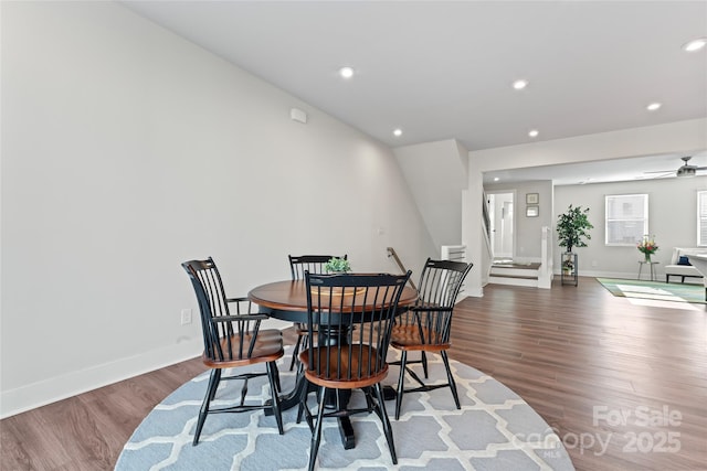 dining area with baseboards, dark wood finished floors, a ceiling fan, stairs, and recessed lighting