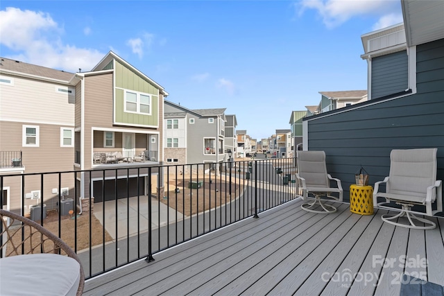 wooden deck with a residential view