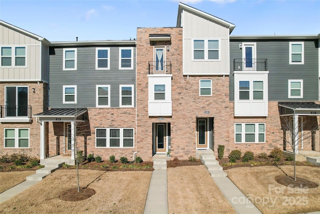 townhome / multi-family property featuring board and batten siding