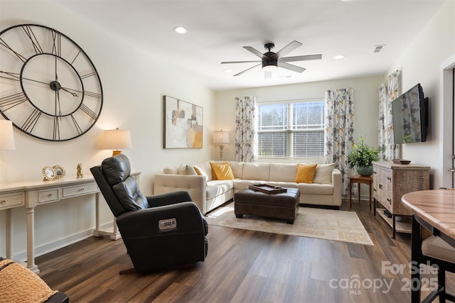 living room with baseboards, visible vents, ceiling fan, dark wood-type flooring, and recessed lighting