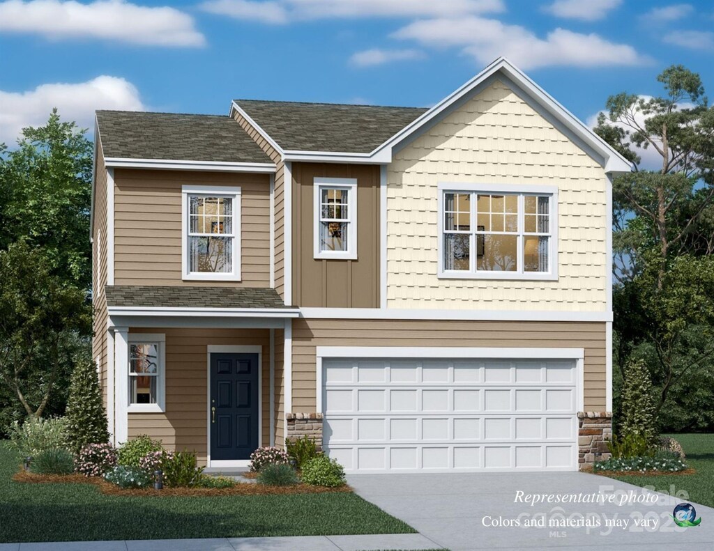 view of front of property with a garage
