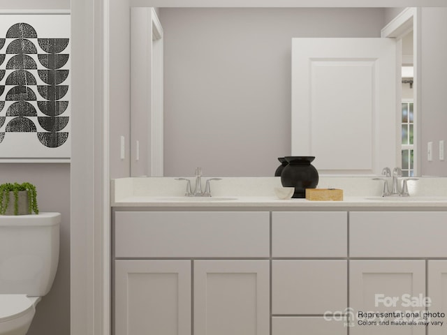 bathroom with vanity and toilet