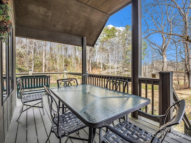 wooden deck with outdoor dining area