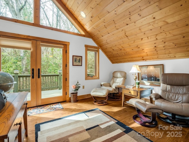 living area featuring french doors, light wood-style flooring, wood ceiling, high vaulted ceiling, and baseboards