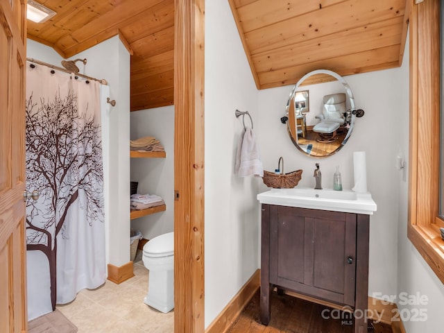 bathroom with lofted ceiling, toilet, wood ceiling, vanity, and baseboards