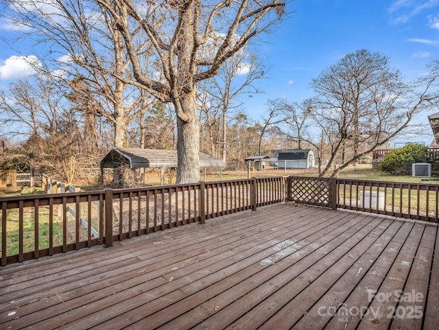 wooden deck featuring central air condition unit