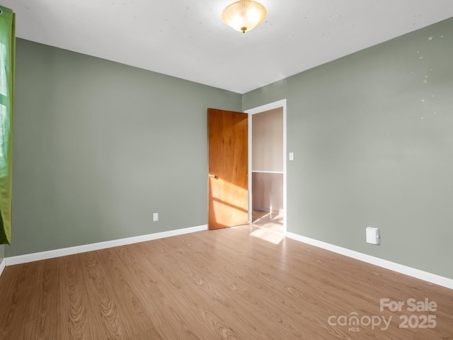 unfurnished room featuring light wood-type flooring