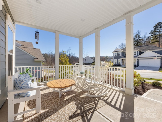 view of patio / terrace featuring a porch and a residential view