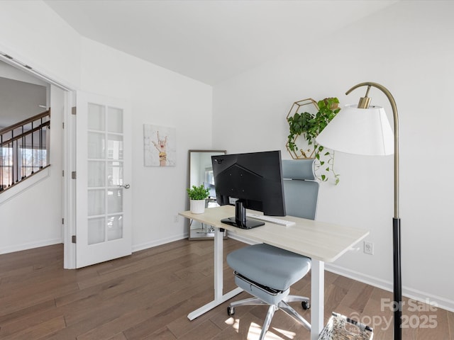 office with dark wood-style flooring and baseboards