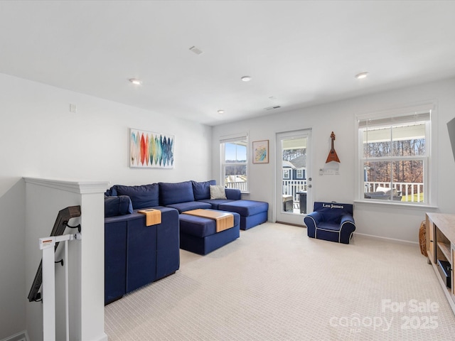 carpeted living room featuring recessed lighting and baseboards