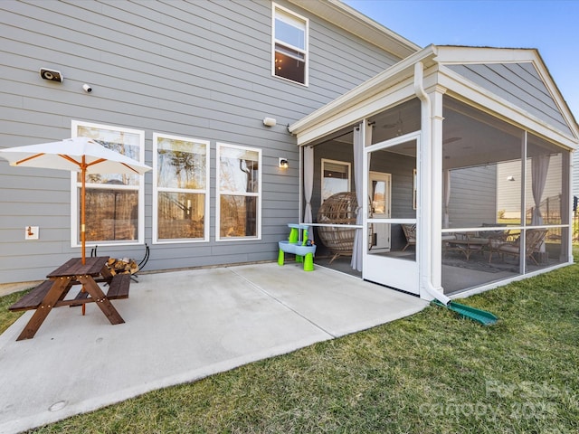 view of patio with a sunroom