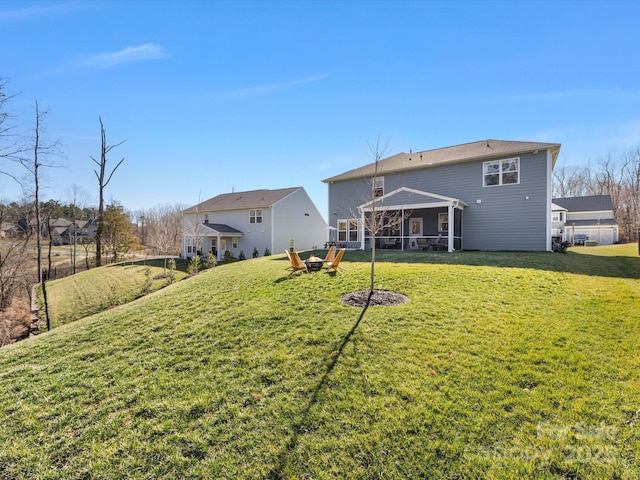 back of property featuring a lawn