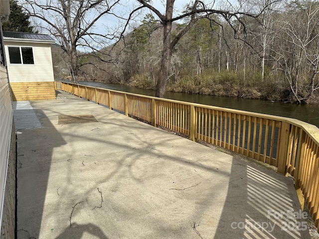 wooden deck with a water view