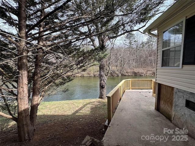 exterior space with a water view