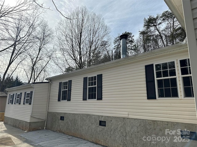 view of side of home with crawl space