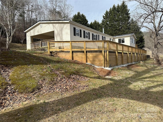 view of home's exterior featuring a wooden deck