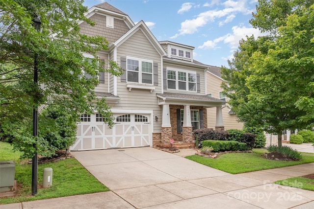 3004 Fallondale Rd, Waxhaw, NC 28173 - craftsman house featuring a garage, driveway, a front lawn, stone siding, and a shingled roof