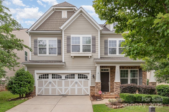 3004 Fallondale Rd, Waxhaw, NC 28173 - craftsman house featuring an attached garage, concrete driveway, stone siding, and roof with shingles