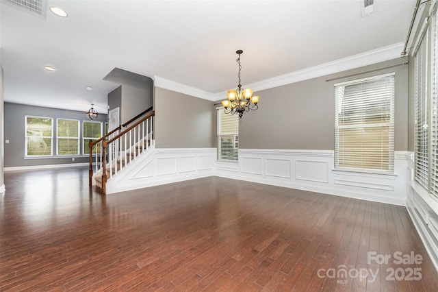 3004 Fallondale Rd, Waxhaw, NC 28173 - spare room with a chandelier, stairs, dark wood finished floors, a wainscoted wall, and recessed lighting