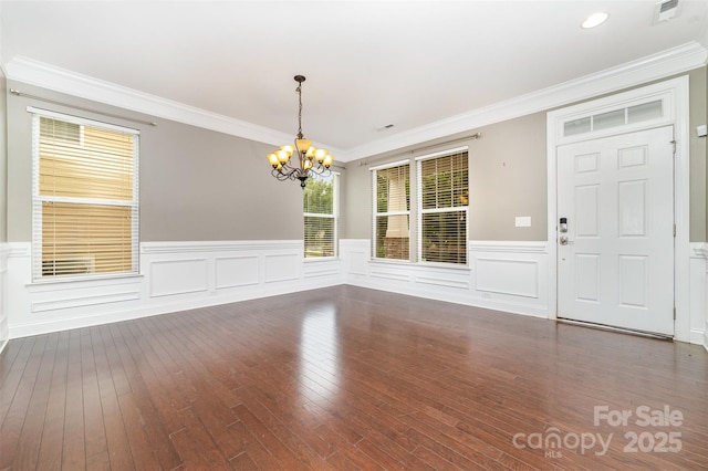 3004 Fallondale Rd, Waxhaw, NC 28173 - unfurnished dining area with a chandelier, wood-type flooring, ornamental molding, and wainscoting