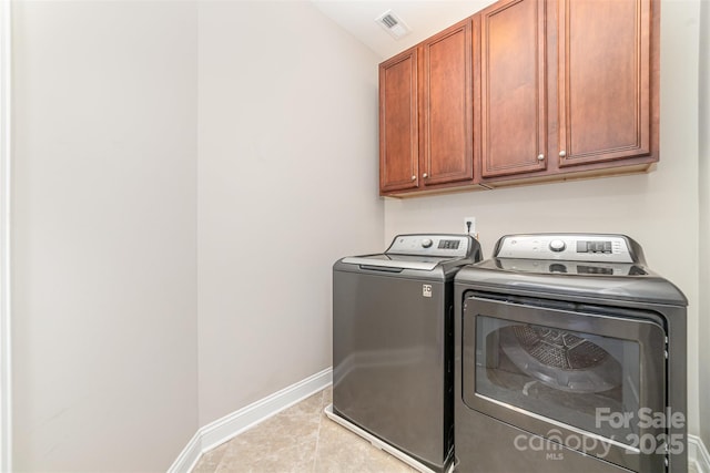 3004 Fallondale Rd, Waxhaw, NC 28173 - laundry room with separate washer and dryer, cabinet space, baseboards, and tile patterned floors