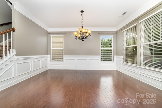 3004 Fallondale Rd, Waxhaw, NC 28173 - unfurnished dining area with a chandelier, dark wood-type flooring, a wainscoted wall, stairway, and crown molding