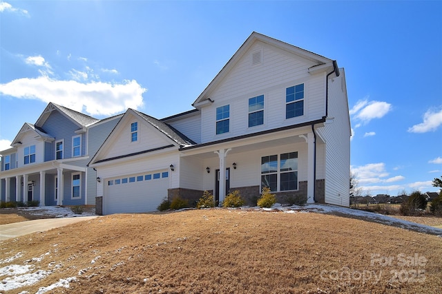 view of front of property featuring covered porch, stone siding, and an attached garage