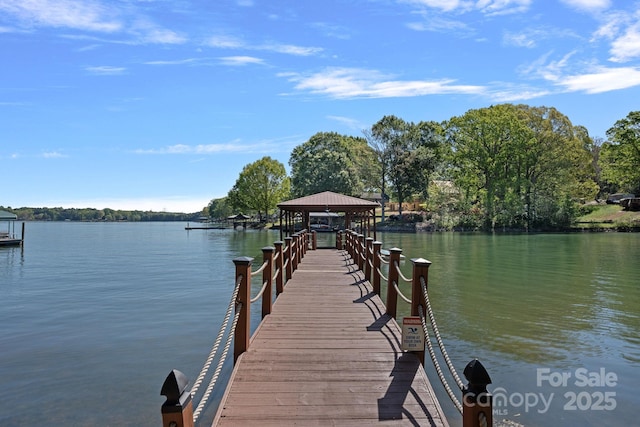 dock area featuring a gazebo and a water view