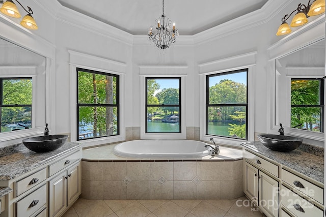 full bathroom with tile patterned flooring, a garden tub, a sink, and two vanities