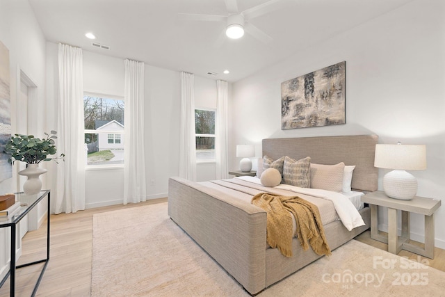 bedroom featuring light wood-type flooring and ceiling fan