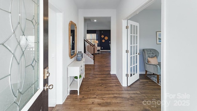 entrance foyer with french doors and dark wood-type flooring