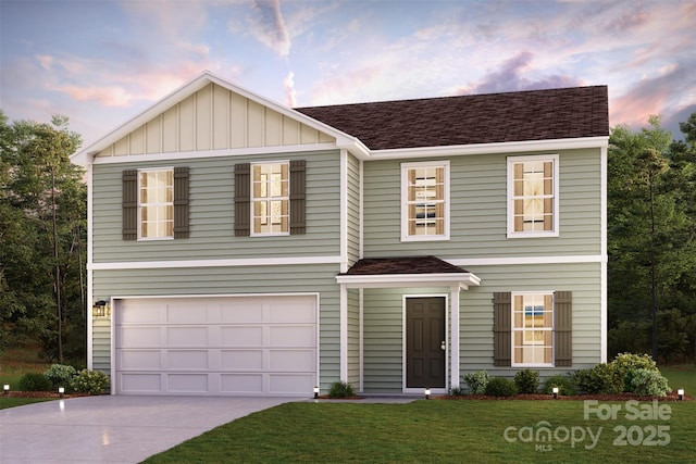 traditional home featuring a lawn, a garage, roof with shingles, concrete driveway, and board and batten siding