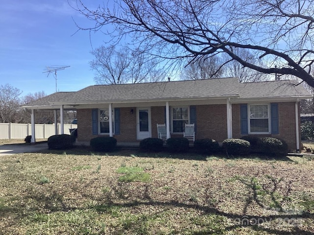 ranch-style house featuring covered porch