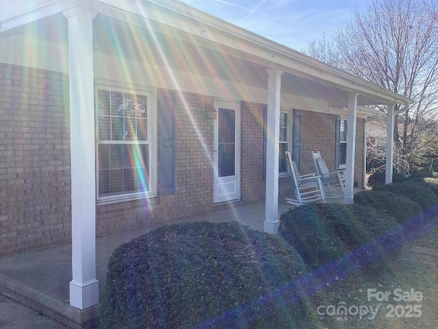 entrance to property with covered porch