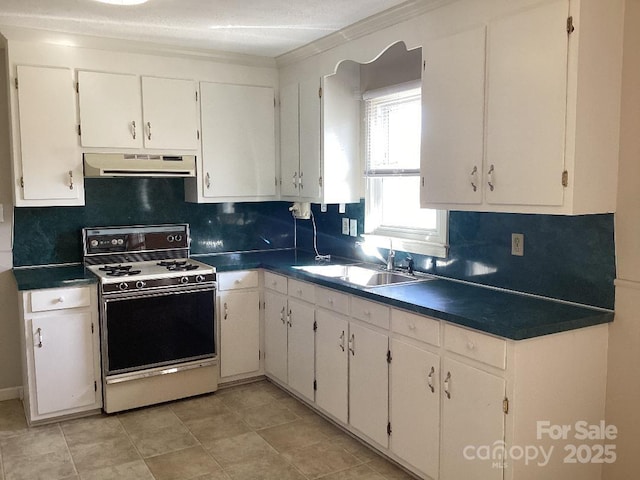 kitchen with white cabinets, white gas stove, and sink