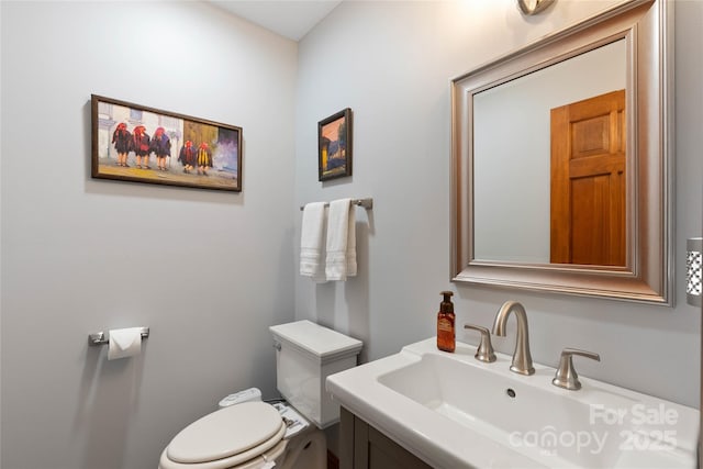 half bath featuring a sink and toilet