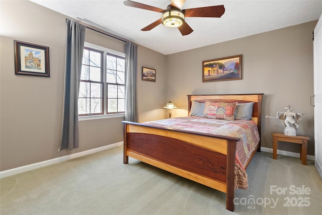 bedroom with light colored carpet, ceiling fan, and baseboards