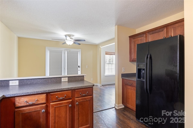 kitchen featuring ceiling fan, dark hardwood / wood-style floors, a textured ceiling, and black fridge with ice dispenser